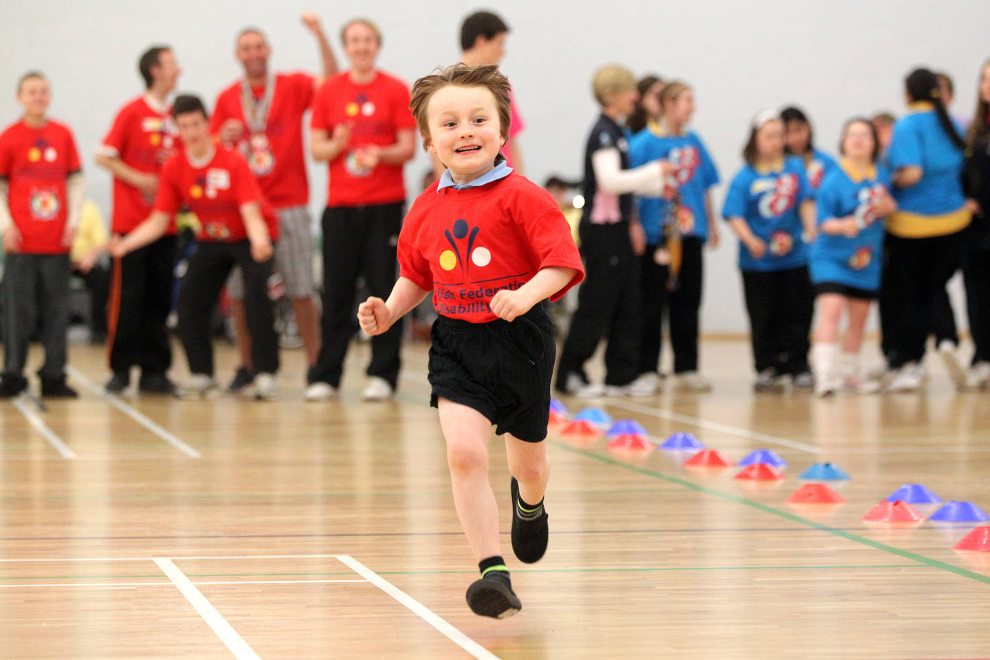 Boy running in a sports hall