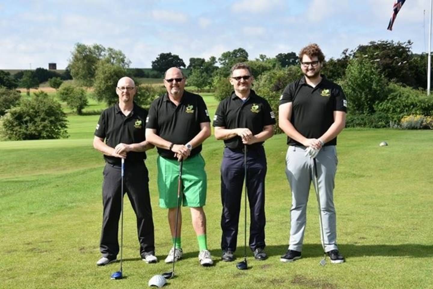 Image shows Simeon Hart, third from the left with his team mates out on the golf course. 