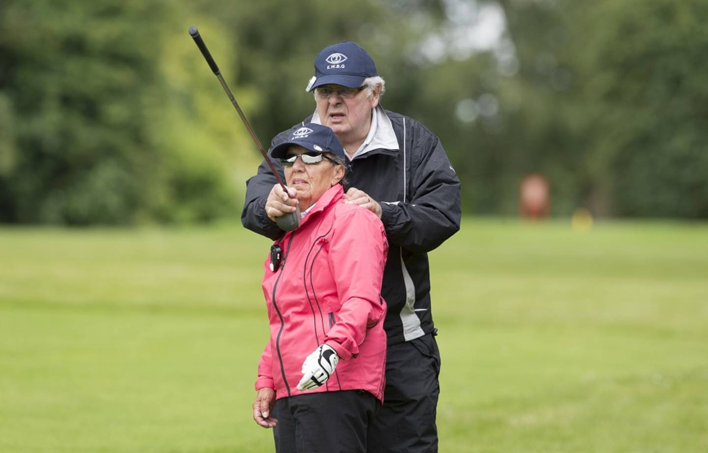Visually impaired women playing golf
