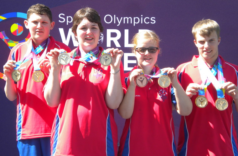 Image shows from left to right Oliver Beadle, Laura Campbell, Lucy Porteous and Aiden Leighton with their tennis medals. 