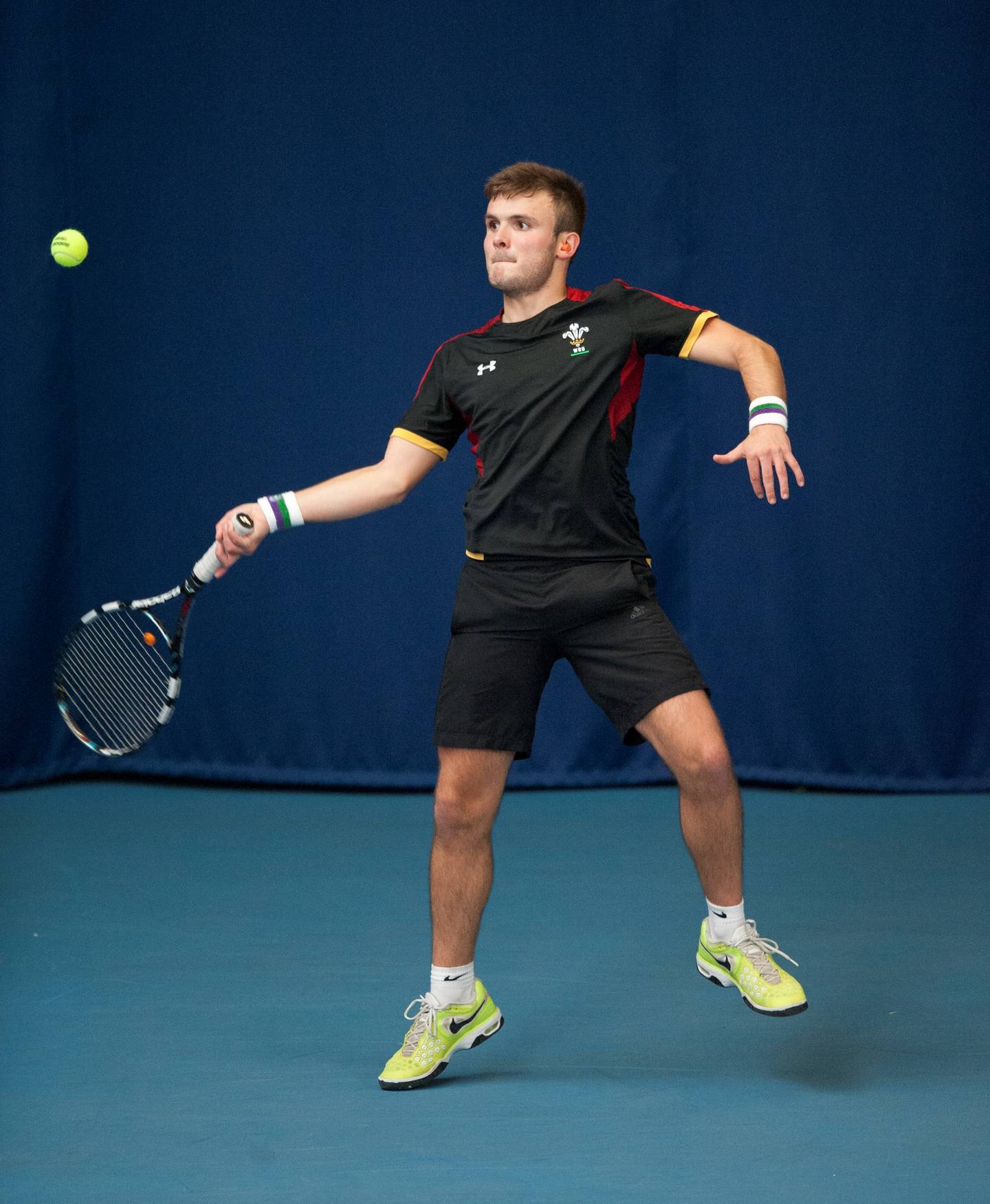 Image shows Shain playing tennis