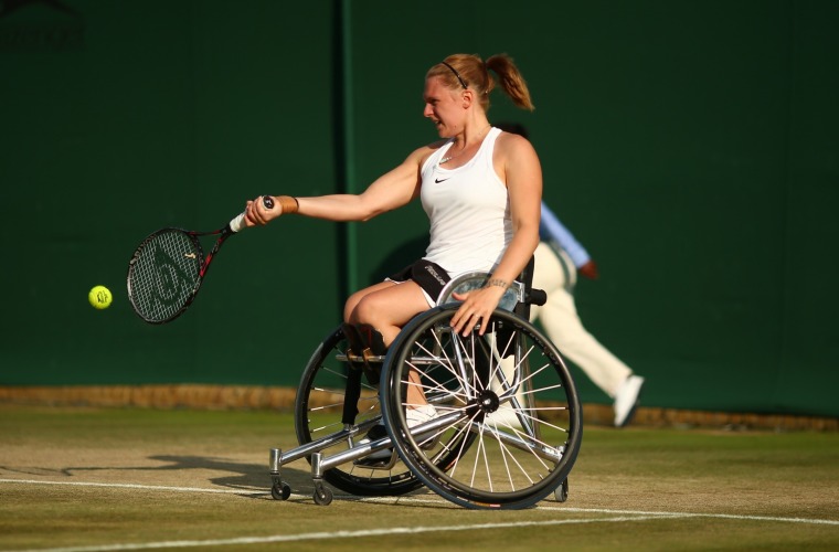 Jordanne Whiley, wheelchair tennis player hitting forehand on grass court