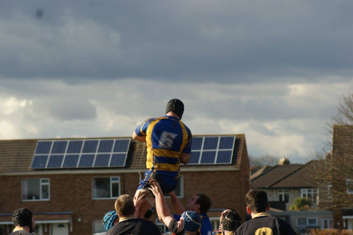 James Russell lifted by his team-mates to catch a rugby ball