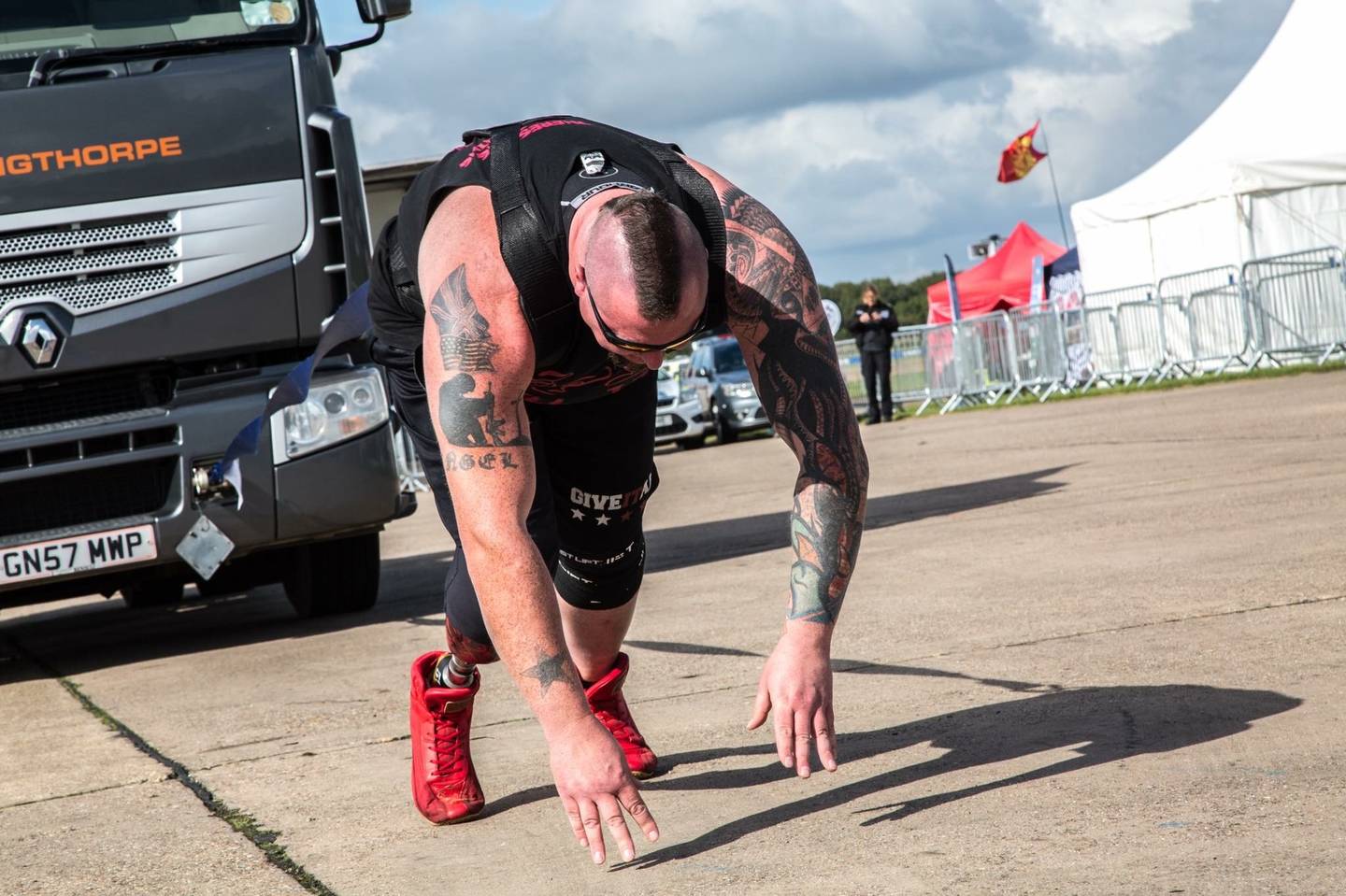 Leigh Bland pulling truck in strongman competition