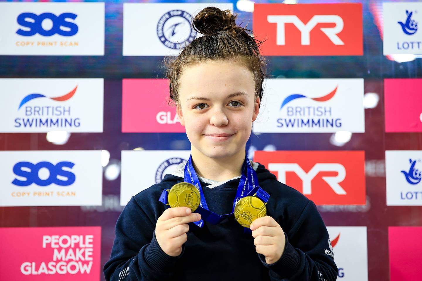 Maisie Summers-Newton with her medals at Glasgow 2019