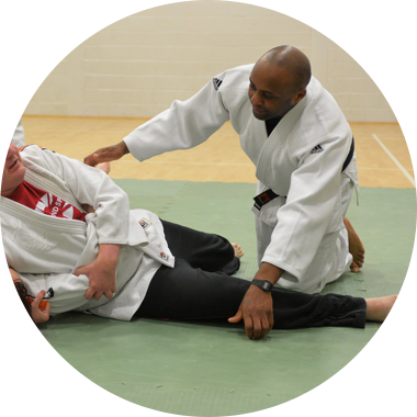 Two visually impaired people taking part in a judo taster session